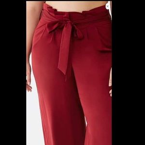 Long paperback woven pants. Burgundy